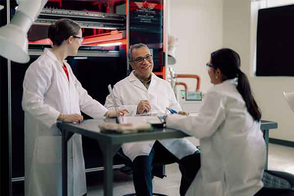 Students and Professor Working in Lab