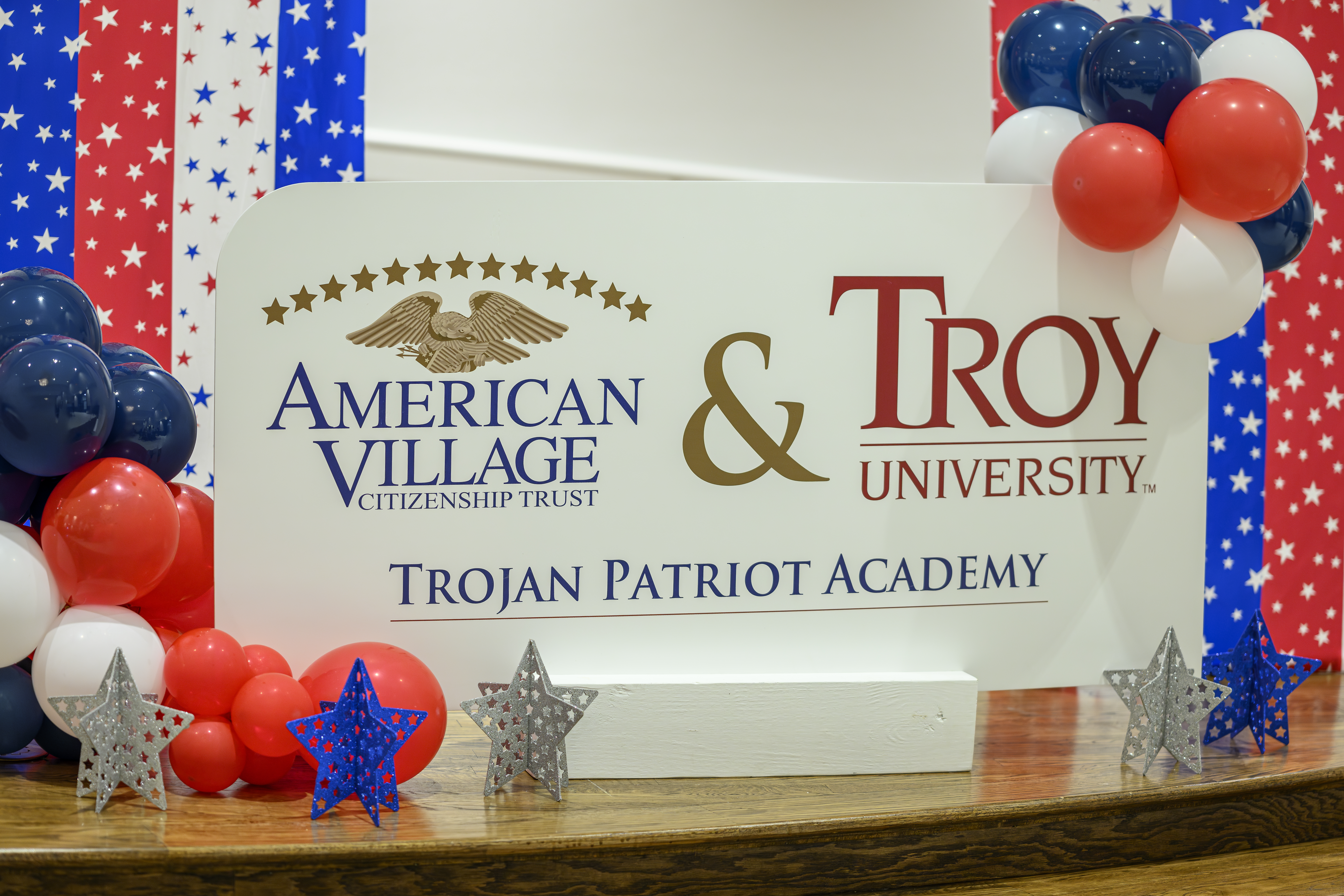 Wide angle photograph of Troy University's campus and American Village