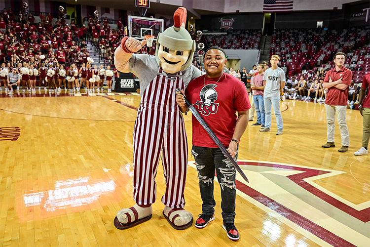 Derrick at a TROY basketball game.