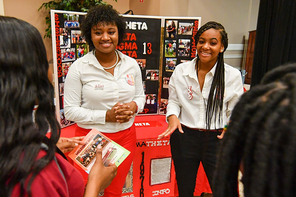 Prospective students speaking with members of a student organization at Trojan Day.