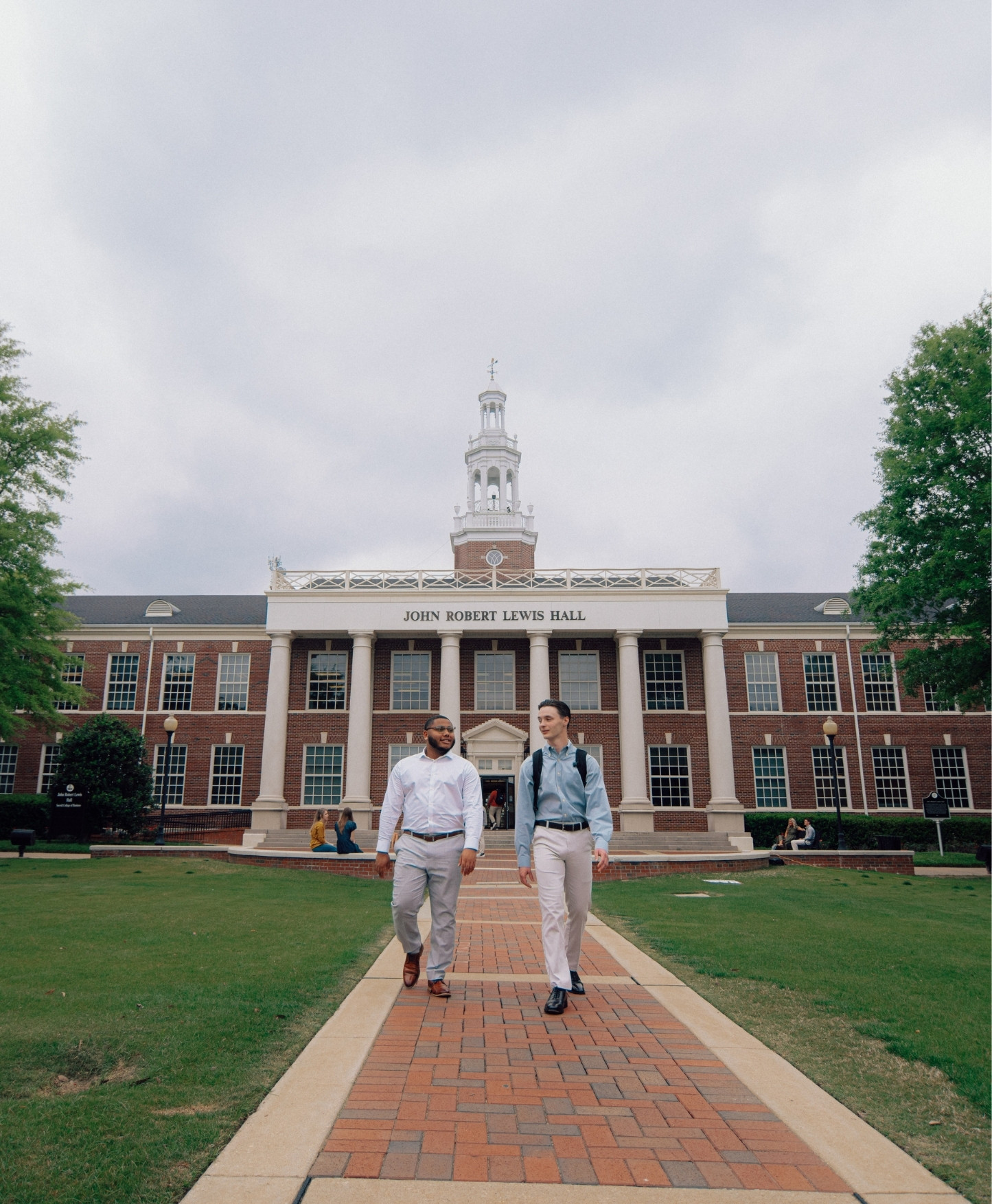 Homepage Header, graduation ceremony with student, left justified text (Heart,Humility, Hardwork).