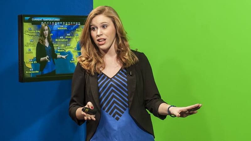 Student, Haley Greathouse, reports on the weather on TrojanVision