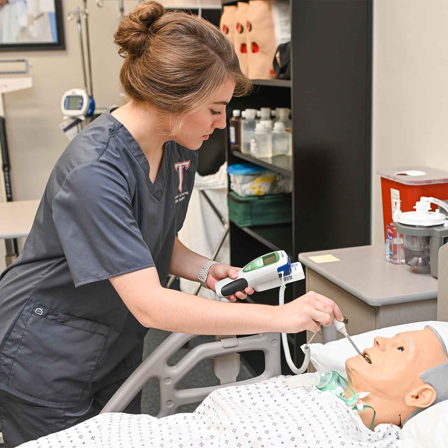 Nurse in lab checking temperature