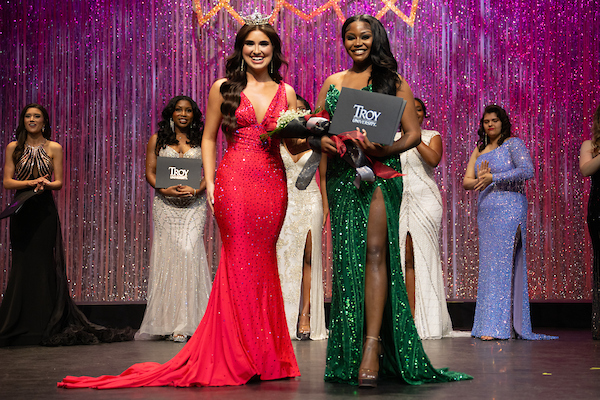 Chandler Paymon is the People's Choice award winner of Miss Troy 2025. She is receiving the award from Sara Jane Houston, Miss Troy University 2024.