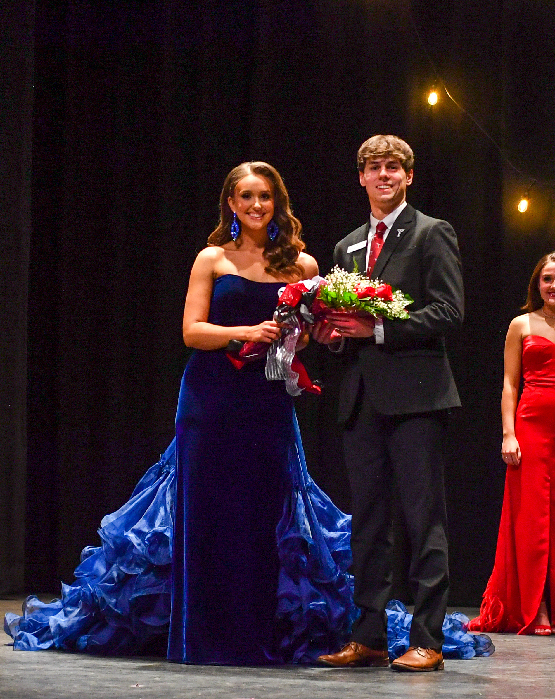 Taylor Jones is the Evening Gown Winner of Miss Troy 2024. She is standing with Troy University SGA president, Theo Theones. 