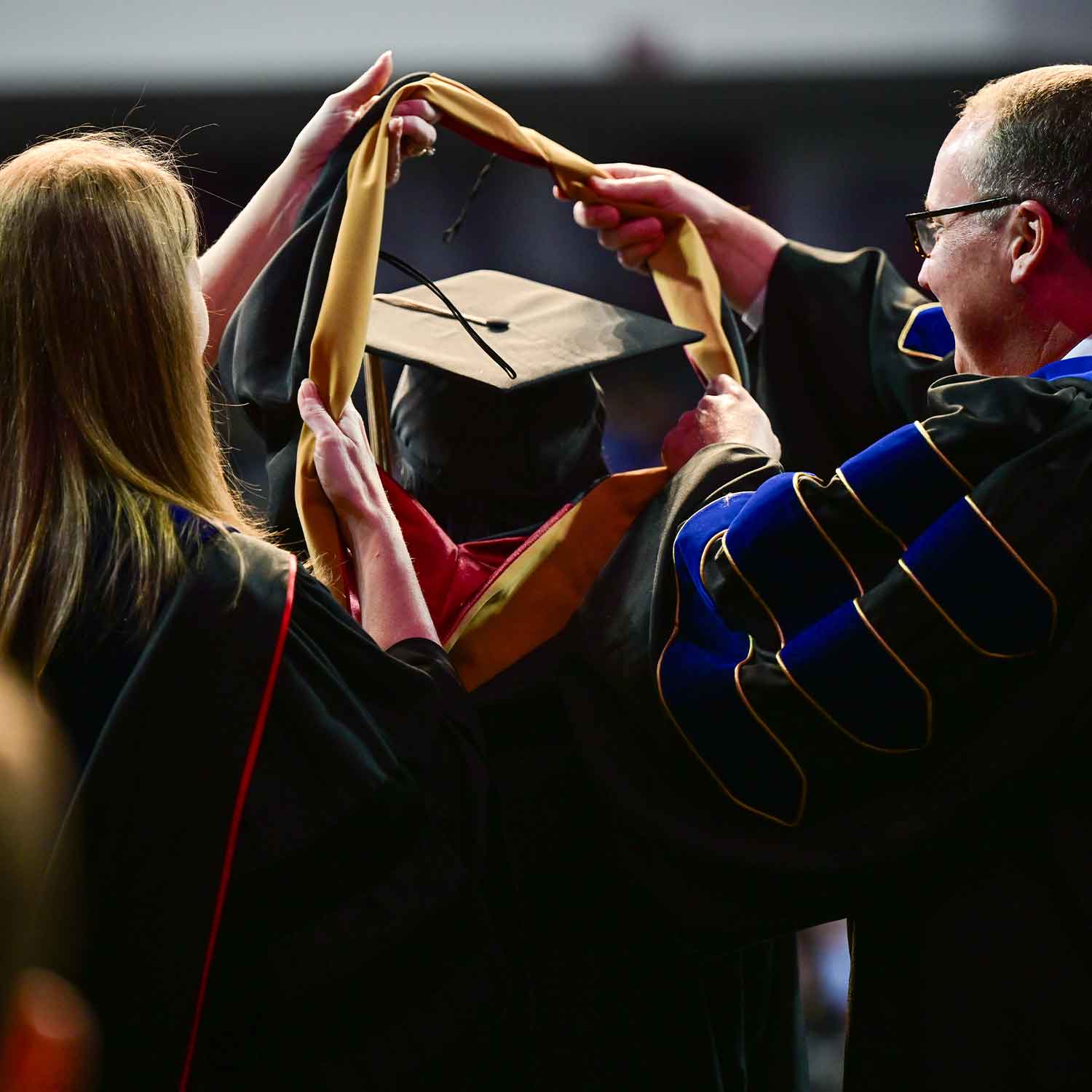 Graduate student at commencement ceremony.