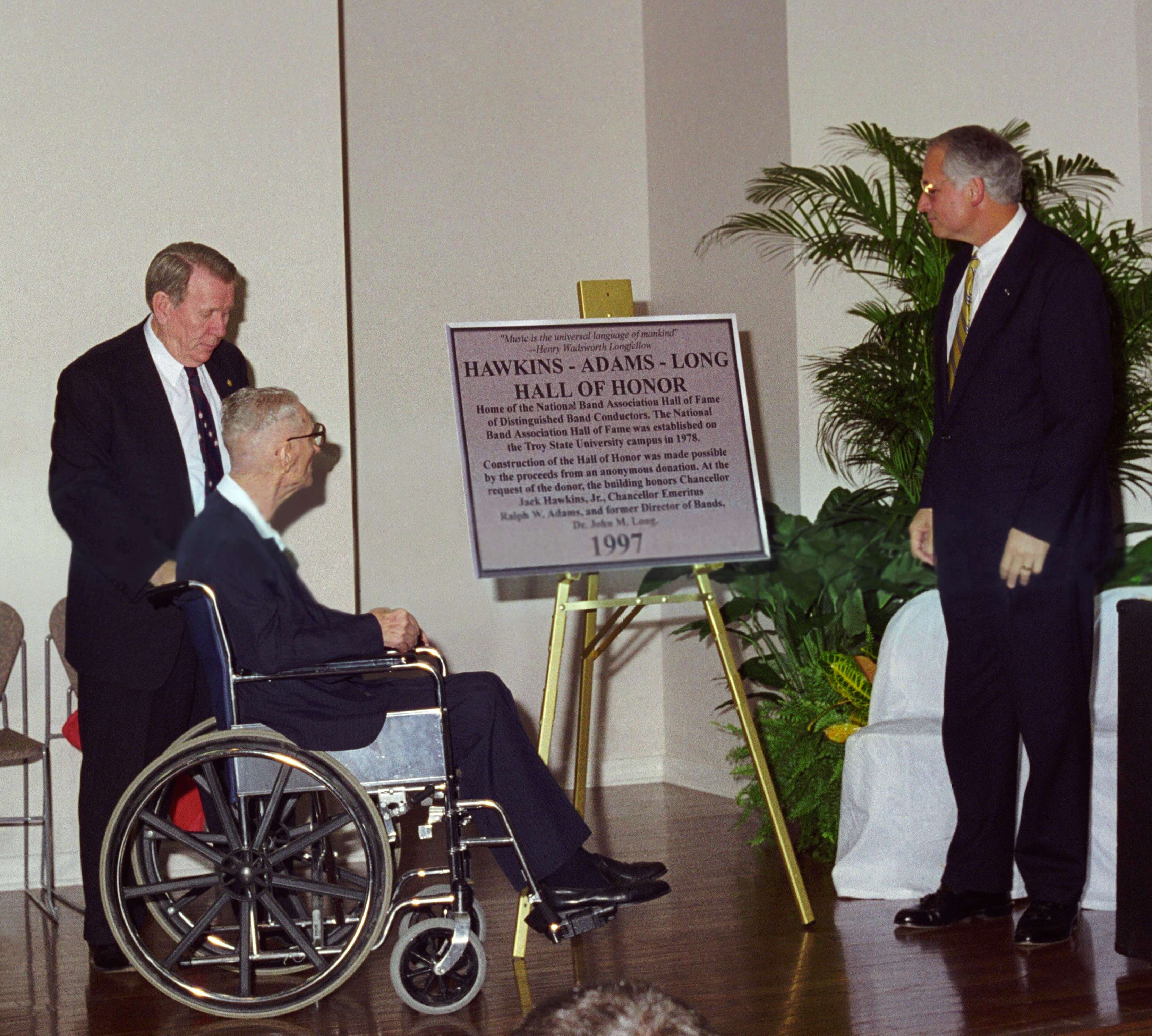 (from left) Dr. John M. Long, Dr. Ralph Wyatt Adams and Dr. Jack Hawkins, Jr., read the dedicatory plaque during ceremonies at the new Hawkins-Adams-Long Hall of Honor in 1997.