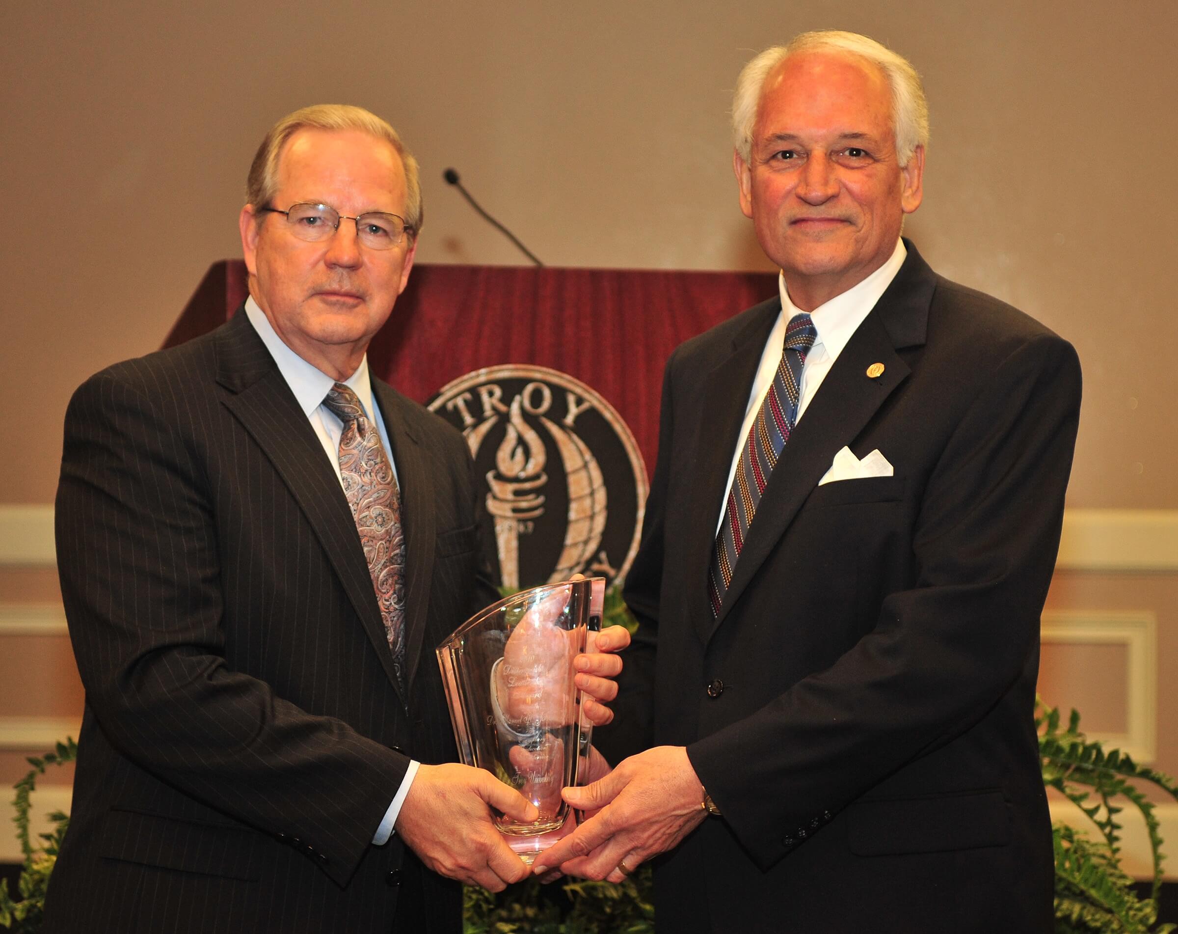 Chancellor Hawkins presents the 2010 Distinguished Leadership Award to Dr. Manley Johnson.