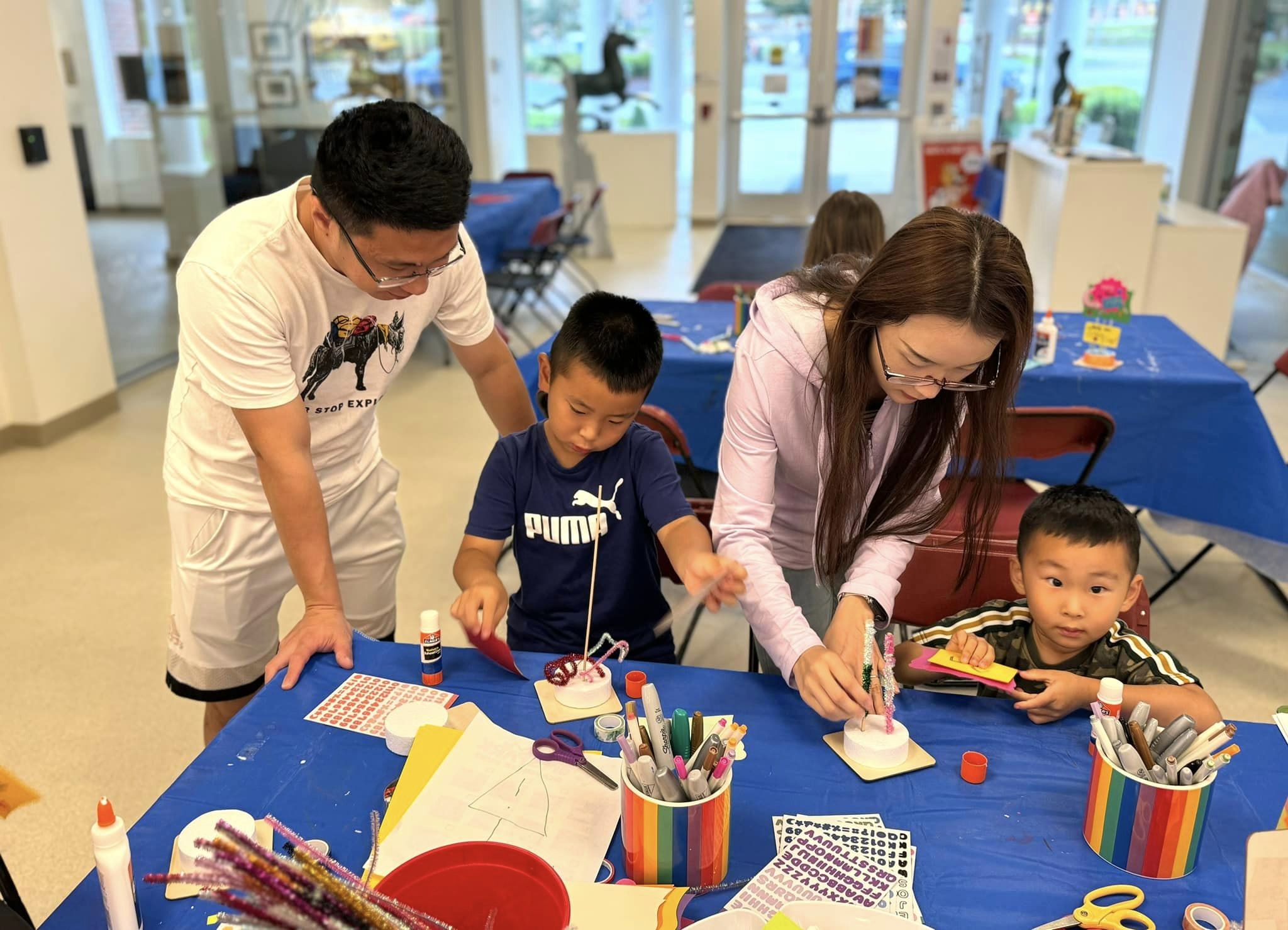 A family working on artSPARK activity together