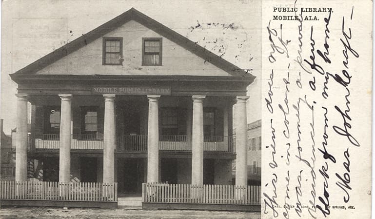 Black and white photograph of the public library building in Mobile, Alabama. Postmarked August 8, 19??.