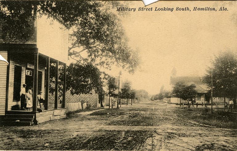 Black and white print of unpaved Military Street in Hamilton, Alabama.