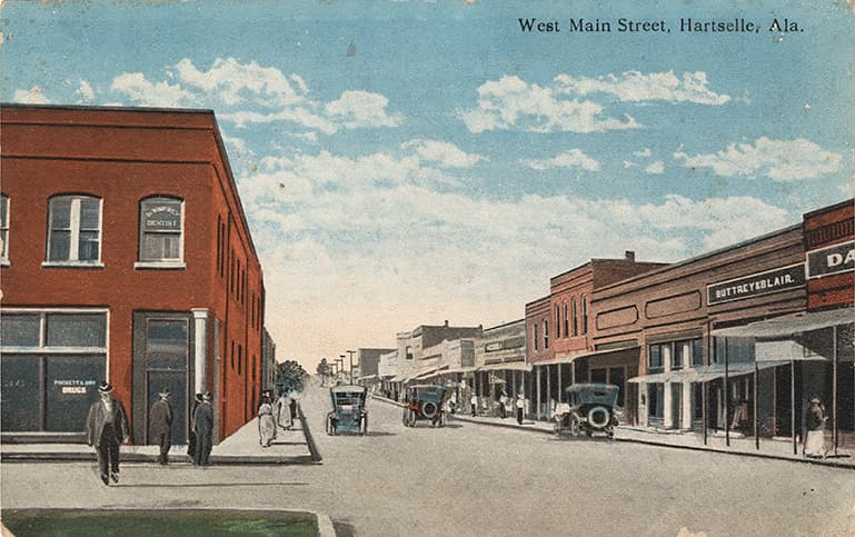 Color print of one and two-story commercial buildings on Main Street in Hartselle, Alabama.