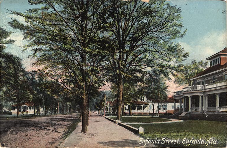 Color print of the residential area of unpaved Eufaula Street in Eufaula, Alabama.