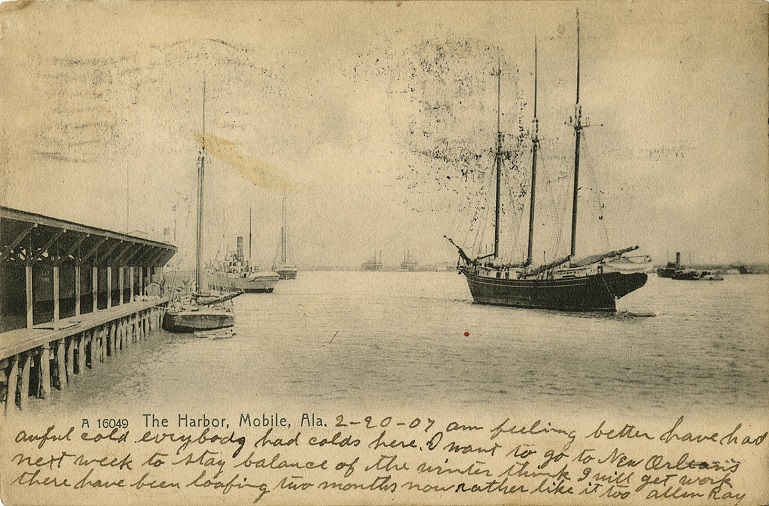 Black and white print of several ships around the harbor in Mobile Bay at Mobile, Alabama. Postmarked February 20, 1907.