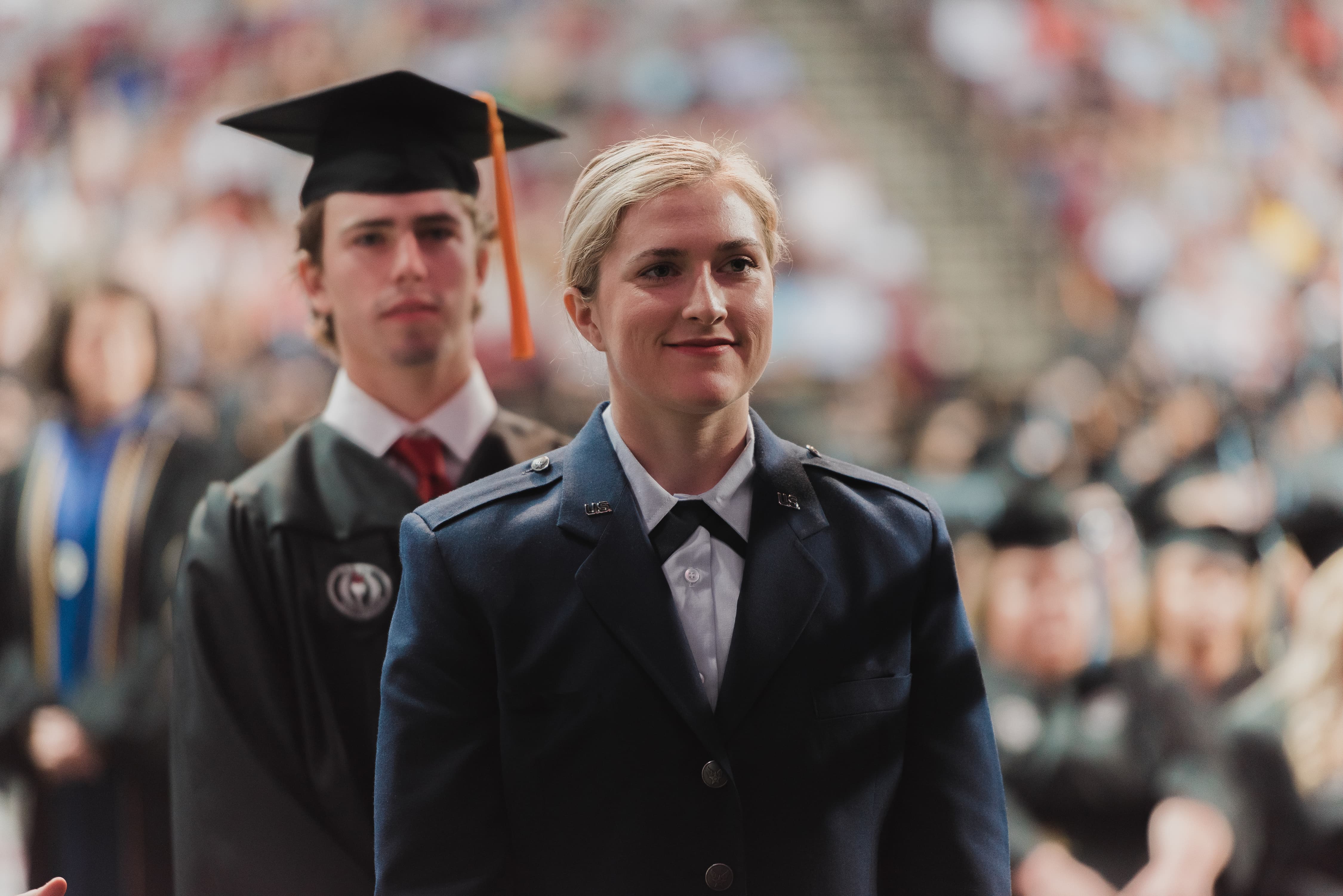 Military student walking at graduation.