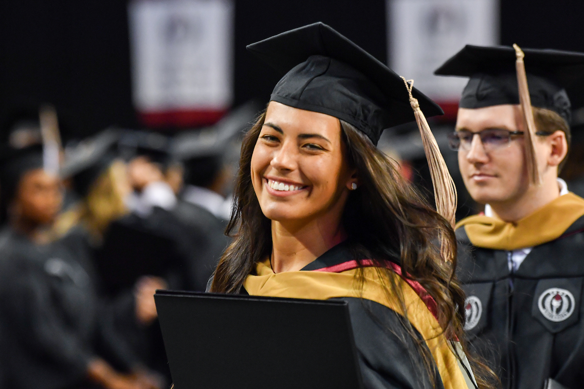 Graduate at commencement