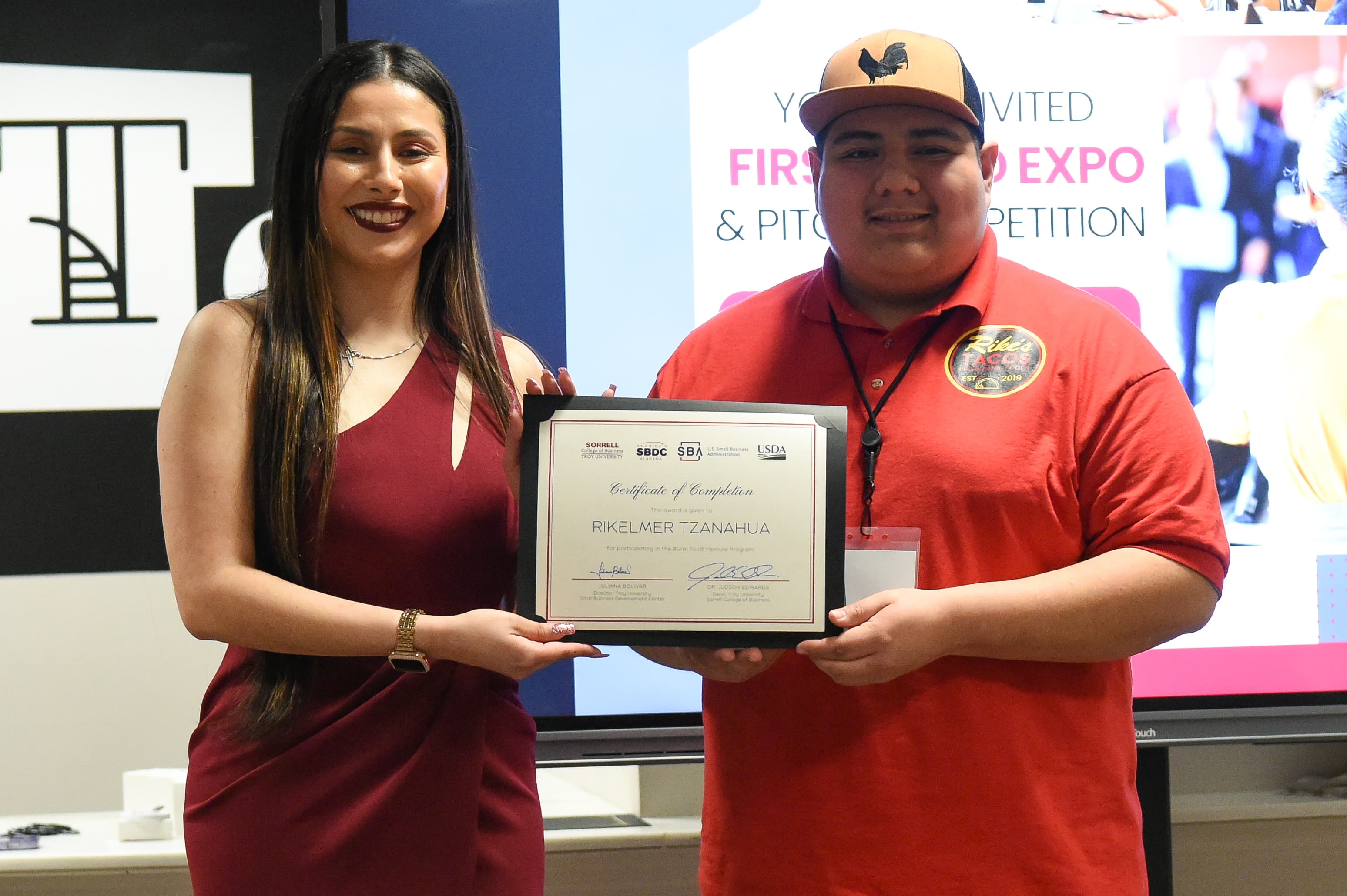 Juliana Bolivar and Rike Tzanahua, the owner of Rike's Tacos, winner of USDA Pitch Competition