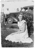 [Sept. 29] 1948, Lacey Smith sitting; Preston Smith in hat; Pauline Hawkins visible behind car.
