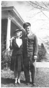 Sgt. William Campbell, standing with older woman (possibly his mother) before home (possibly in Dothan, AL), ca. 1942. 